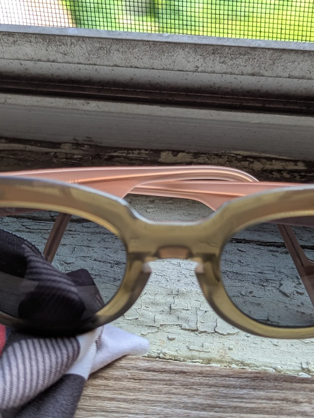 Anne Et Valentin Sunglasses with Brown/Olive Front And Peach temples.
